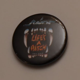 Raven - Life's a Bitch (Badge)